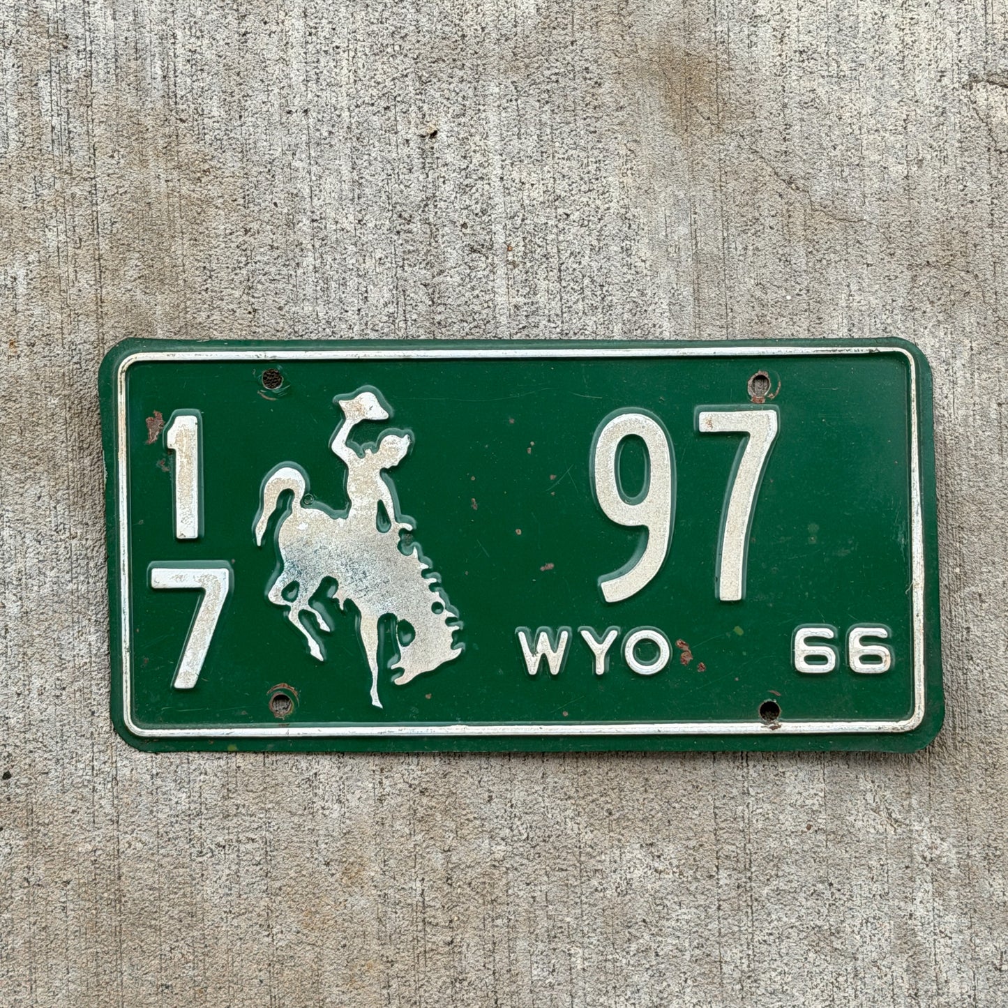 Photo of a 1966 Wyoming License Plate Auto Tag Garage Decor Vintage Cowboy Rodeo 17 97 with original patina