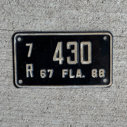Photo of a 1967 1968 Florida Motorcycle License Plate Auto Tag Garage Decor Vintage Orange County 7R 430 with original patina