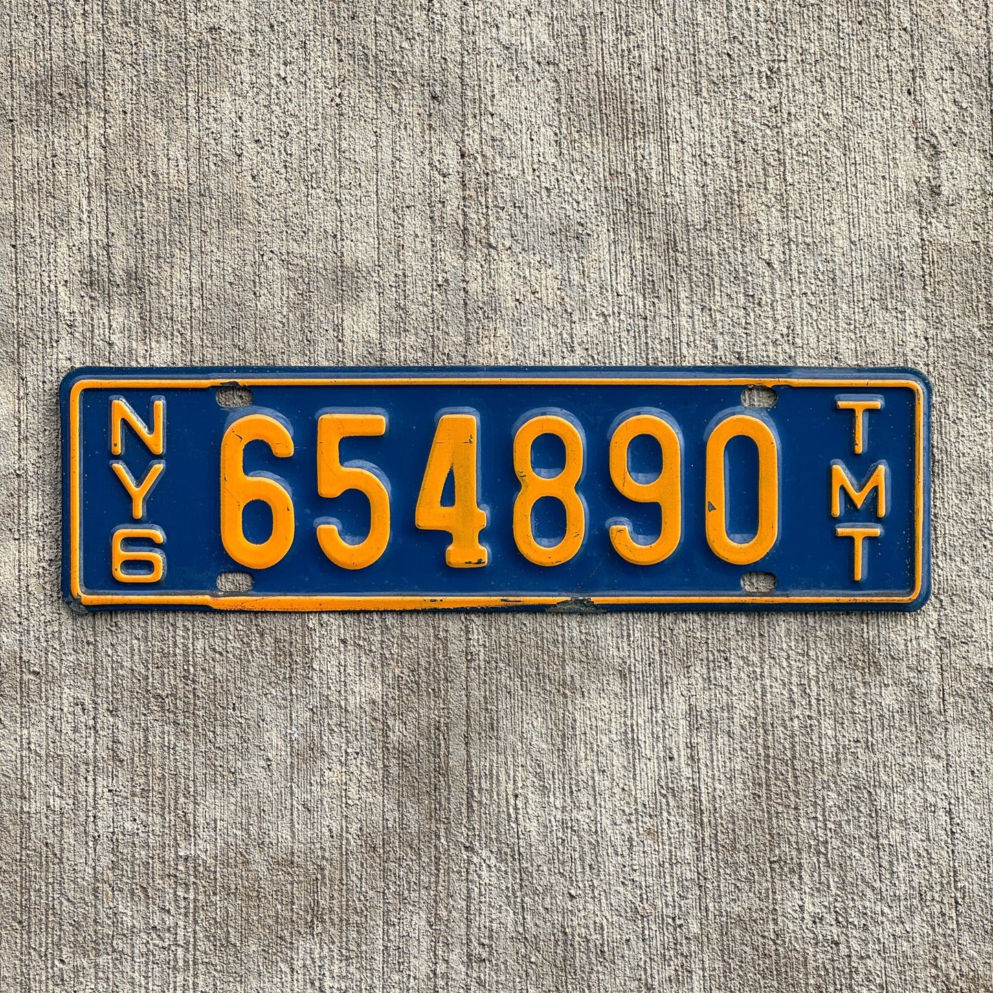 Photo of a 1967 1969 New York Truck Mile Tax License Plate Auto Tag Garage Decor Vintage Series 6 654890 with original patina