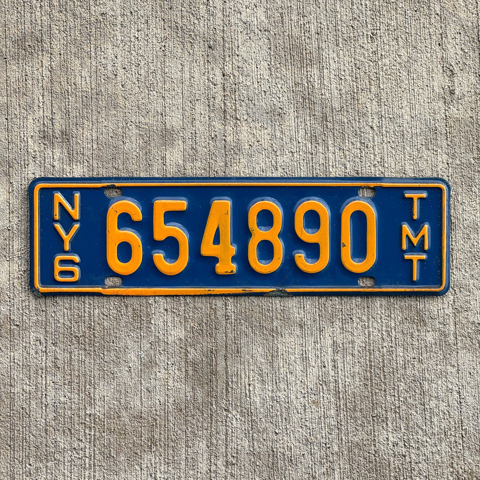 Photo of a 1967 1969 New York Truck Mile Tax License Plate Auto Tag Garage Decor Vintage Series 6 654890 with original patina
