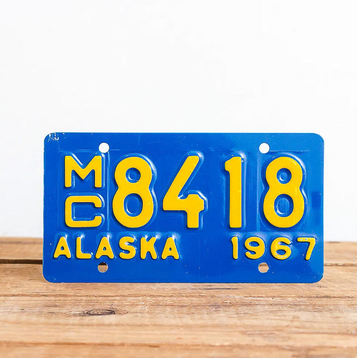 Photo of a 1967 Alaska Motorcycle Auto Tag Garage Decor Vintage 8418 with original patina