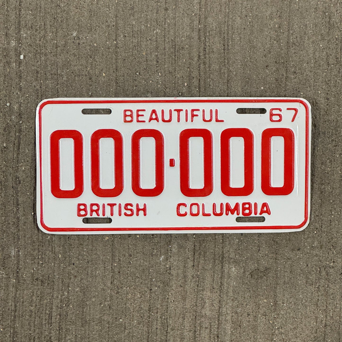 Photo of a 1967 British Columbia SAMPLE License Plate Auto Tag Garage Decor Vintage 000 000