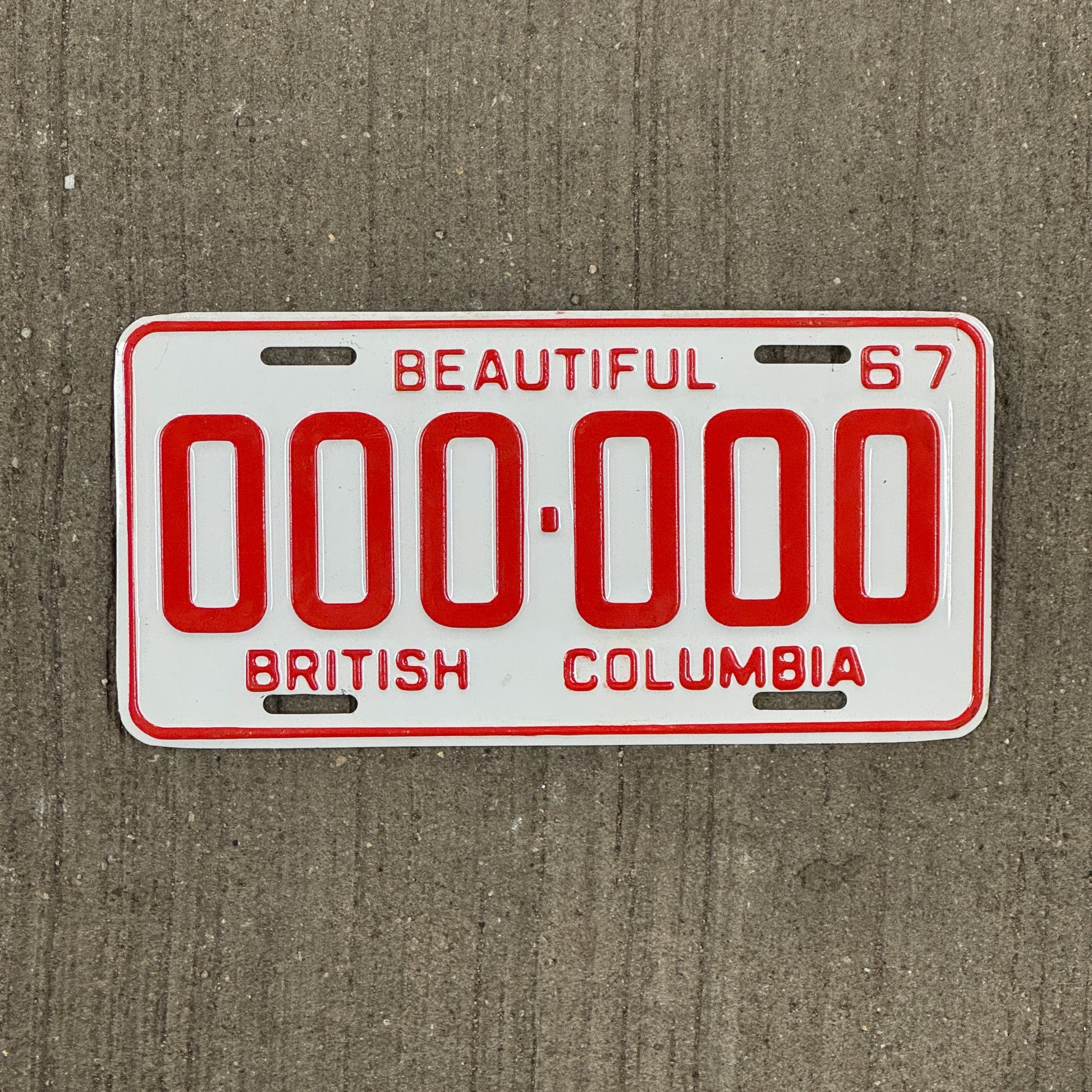 Photo of a 1967 British Columbia SAMPLE License Plate Auto Tag Garage Decor Vintage 000 000
