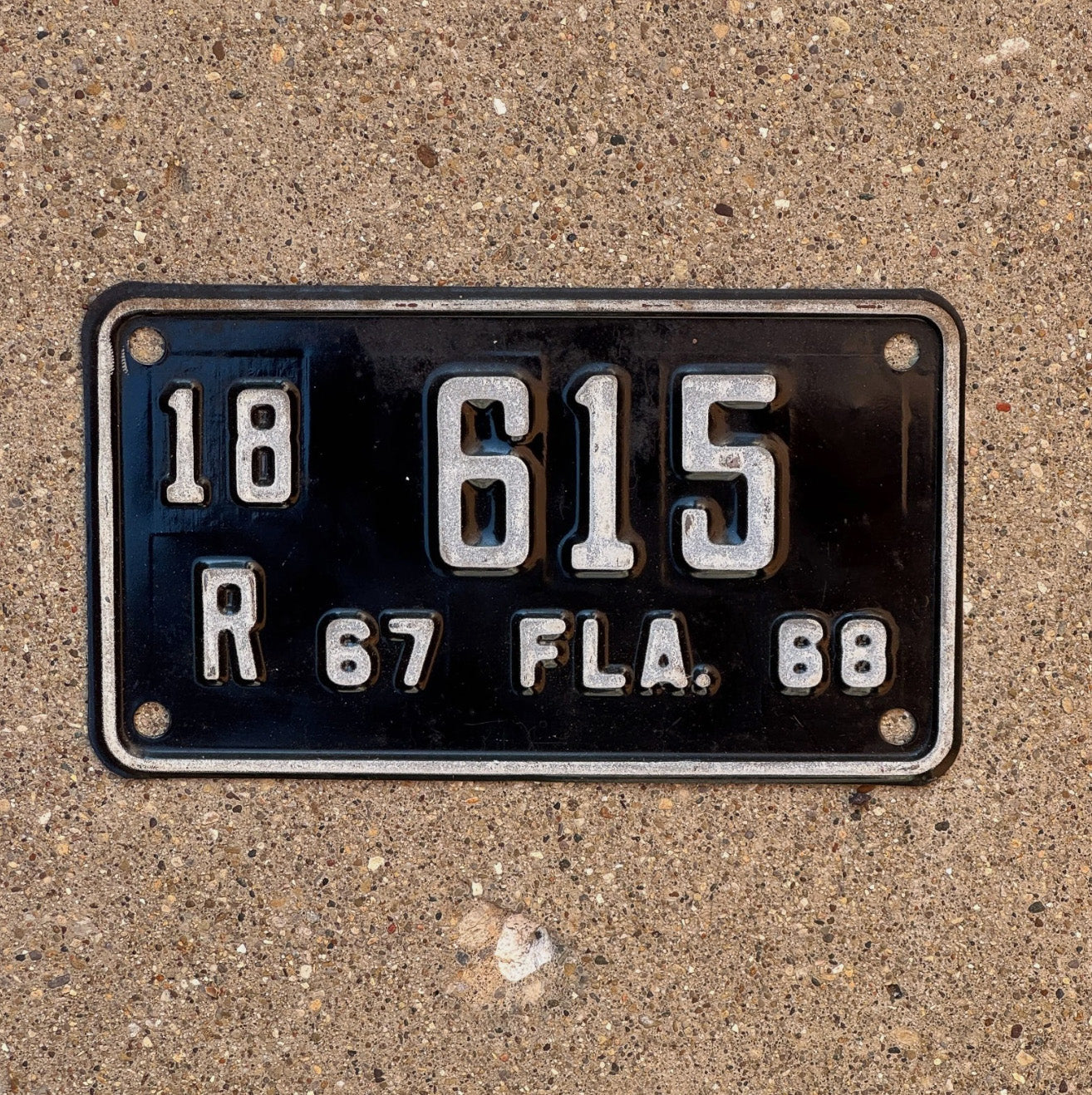 Photo of a 1967 Florida Motorcycle License Plate Auto Tag Garage Decor Vintage Lee County 3 Digit 18 R 615 with original patina