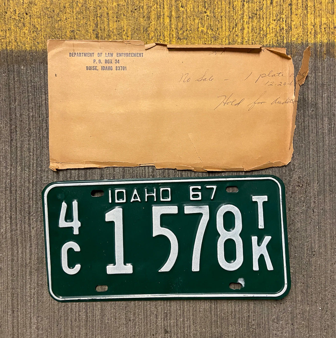 Photo of a 1967 Idaho Truck License Plate Auto Tag Garage Decor Vintage With Envelope 4C 1 578 TK with original patina