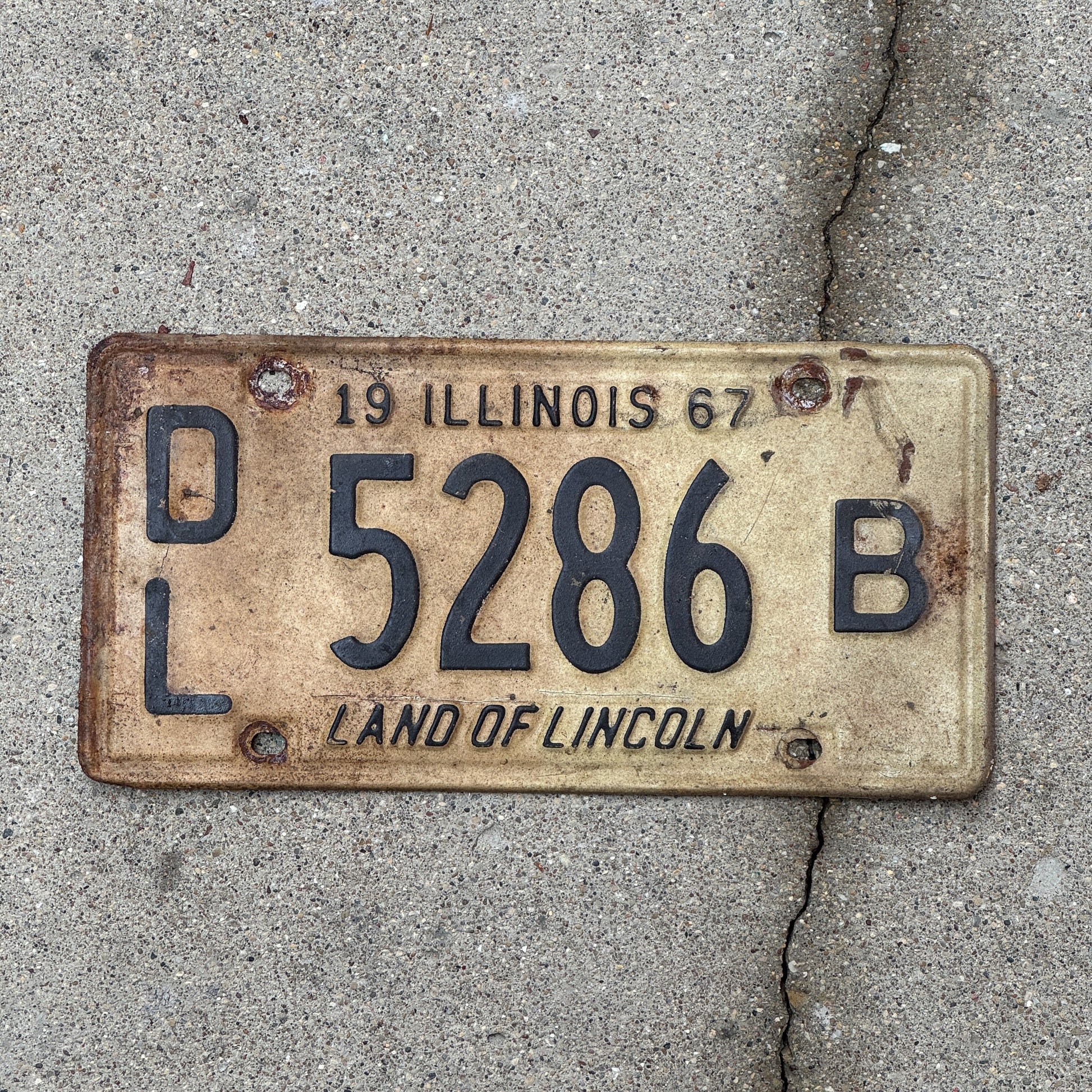 Photo of a 1967 Illinois Dealer License Plate Auto Tag 1 Vintage Garage 5286 B with original patina