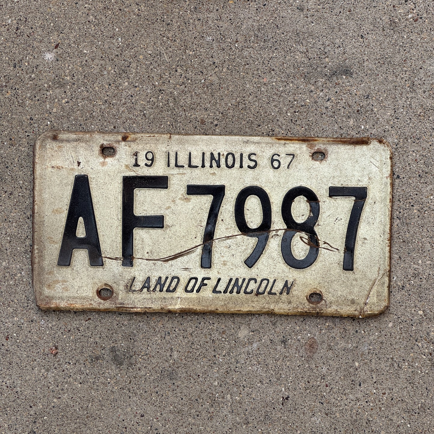 Photo of a 1967 Illinois License Plate Auto Tag 1 Vintage Garage AF 7987 with original patina