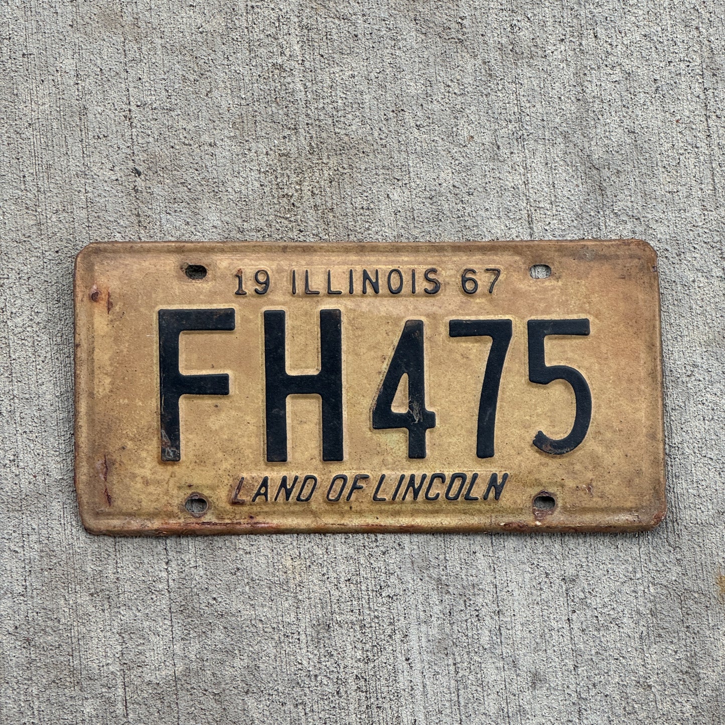 Photo of a 1967 Illinois License Plate Auto Tag 1 Vintage Garage FH 475 with original patina