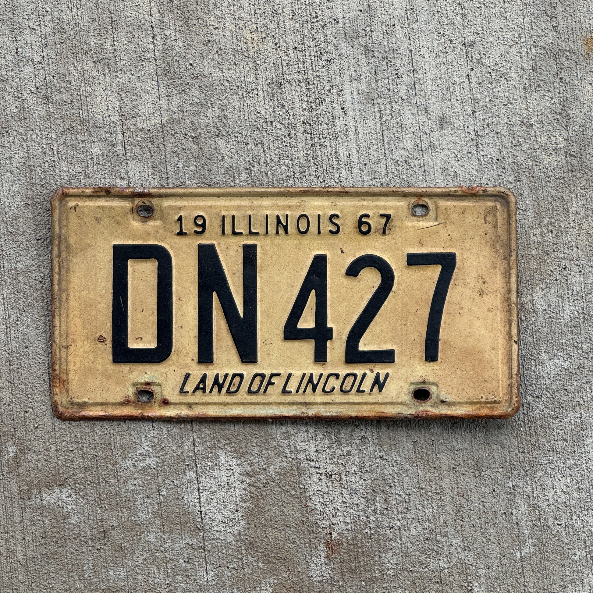 Photo of a 1967 Illinois License Plate Auto Tag 2 Vintage Garage DN 427 with original patina