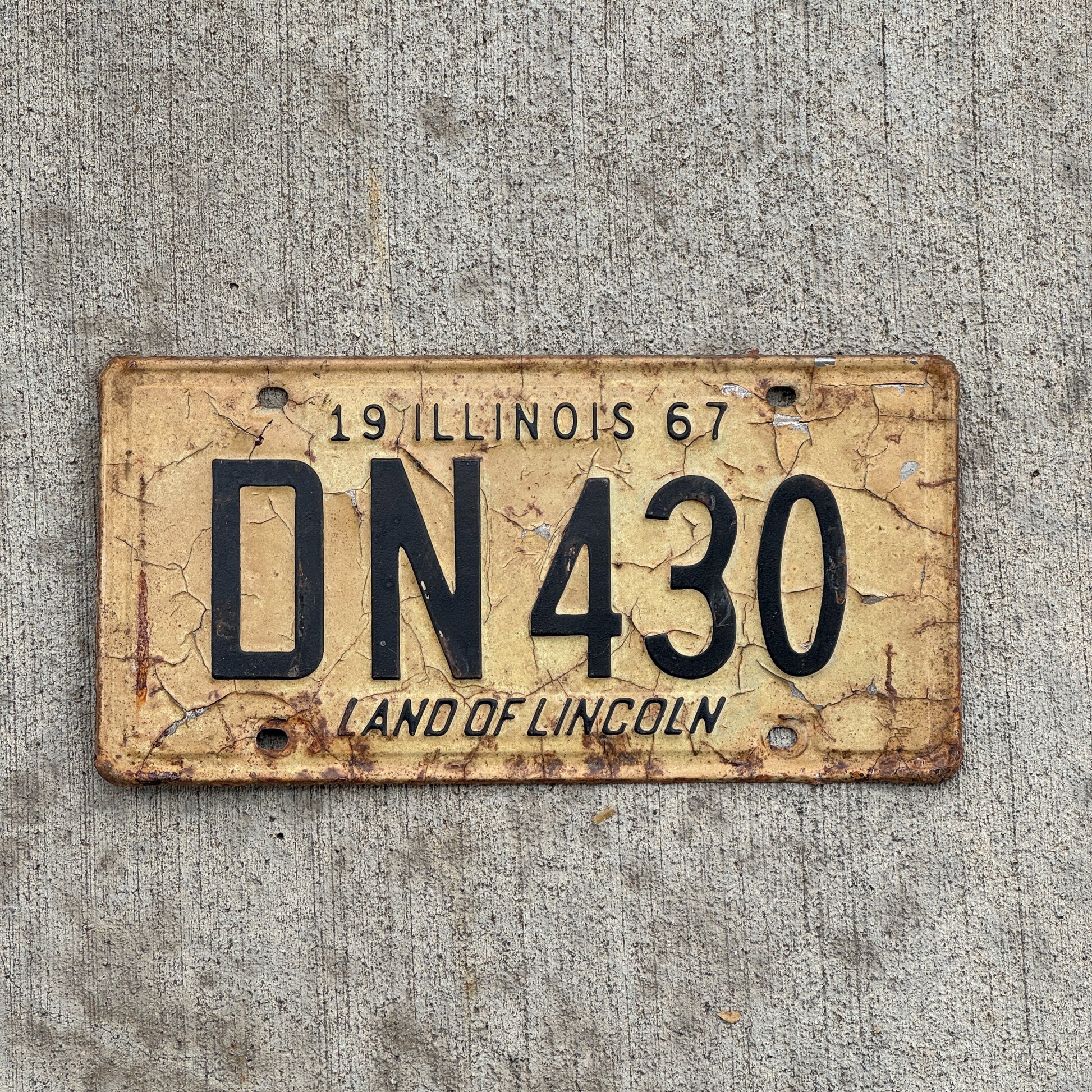 Photo of a 1967 Illinois License Plate Auto Tag 2 Vintage Garage DN 430 with original patina
