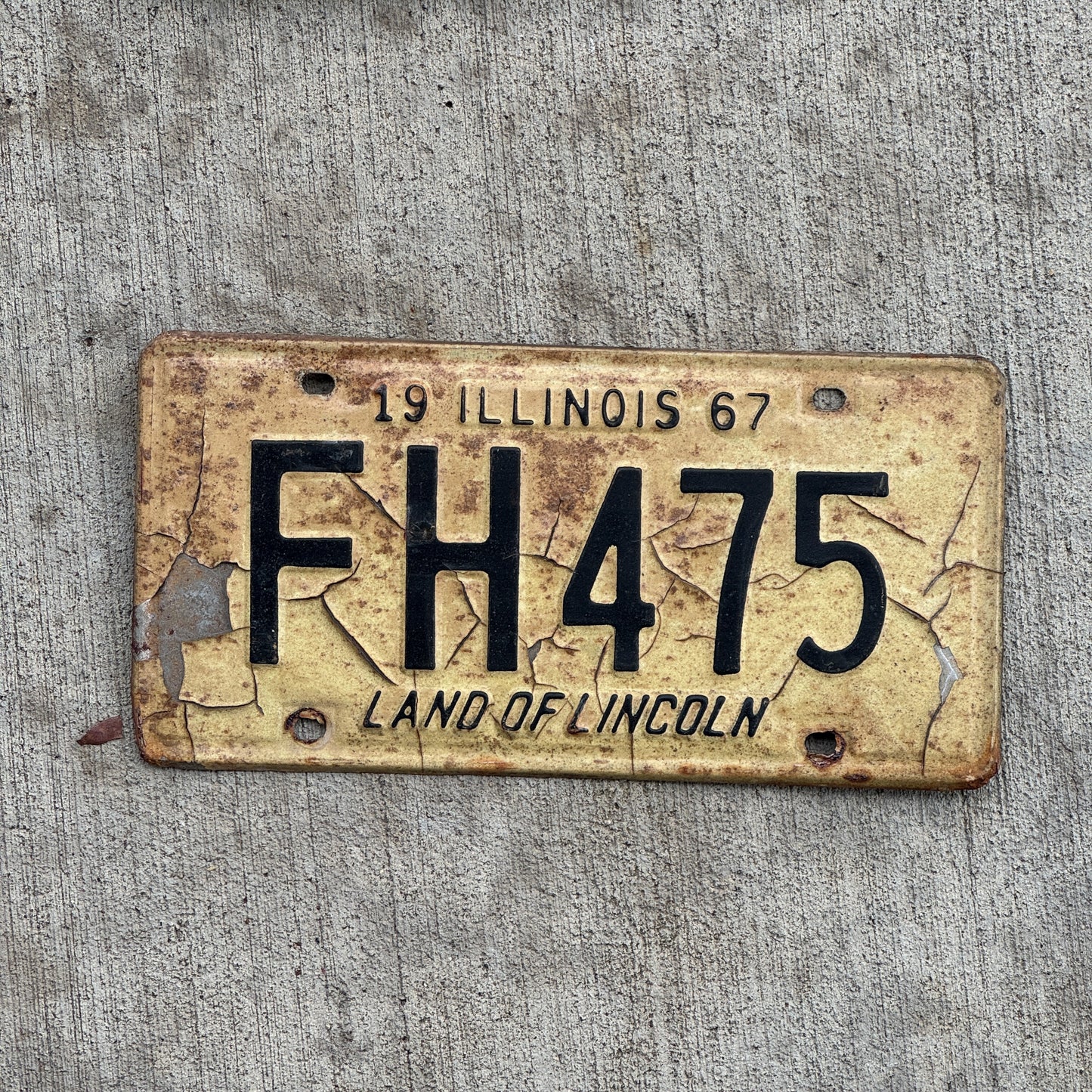 Photo of a 1967 Illinois License Plate Auto Tag 2 Vintage Garage FH 475 with original patina