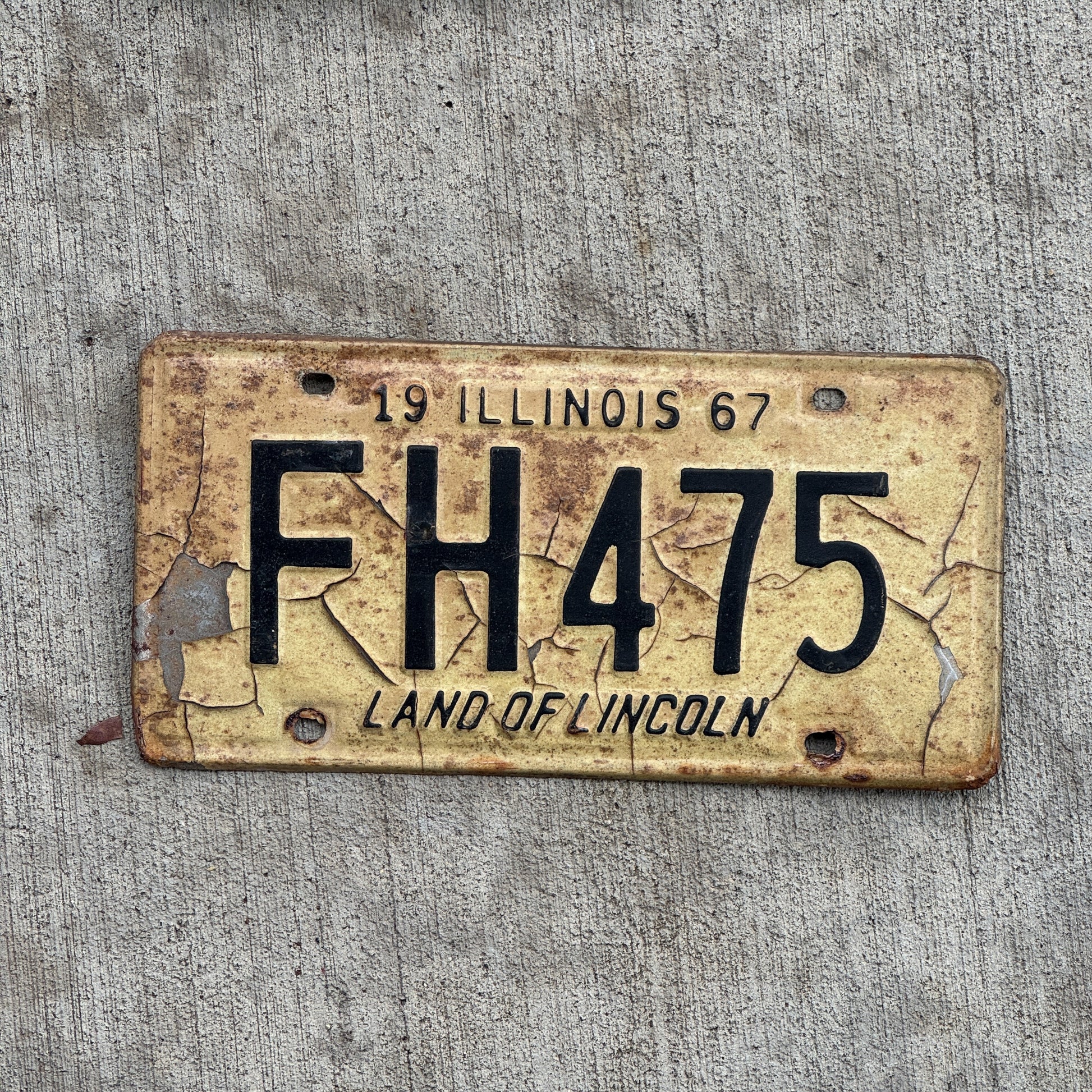 Photo of a 1967 Illinois License Plate Auto Tag 2 Vintage Garage FH 475 with original patina