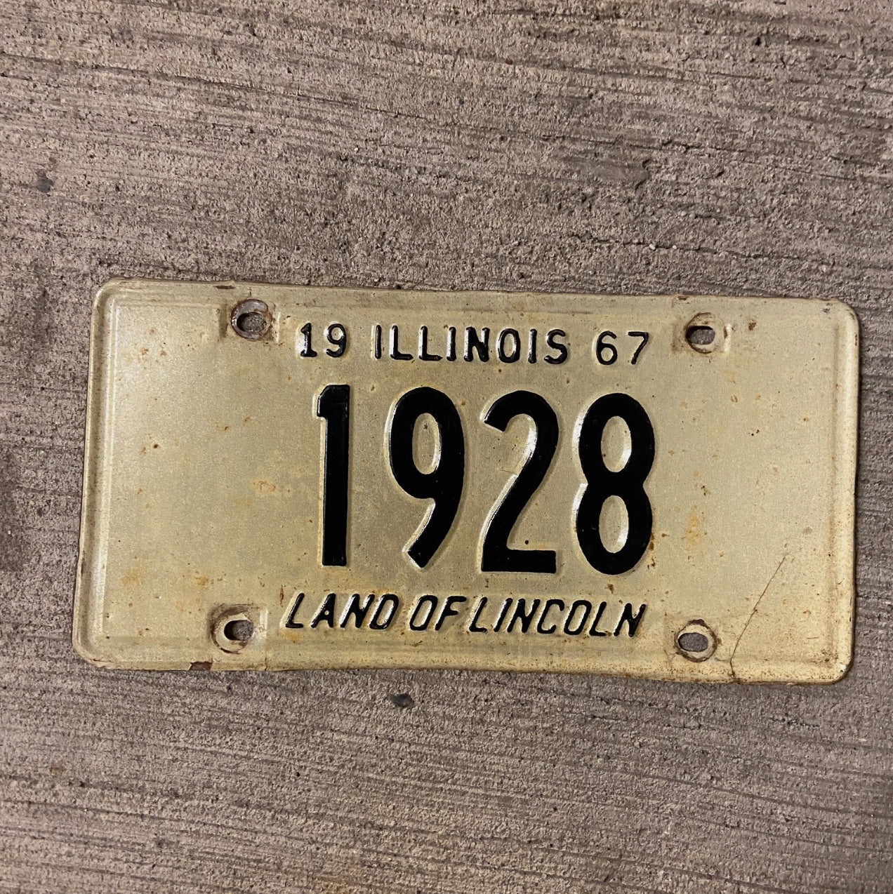 Photo of a 1967 Illinois License Plate Auto Tag Garage Decor Vintage Low Number Four Digit 1928 with original patina