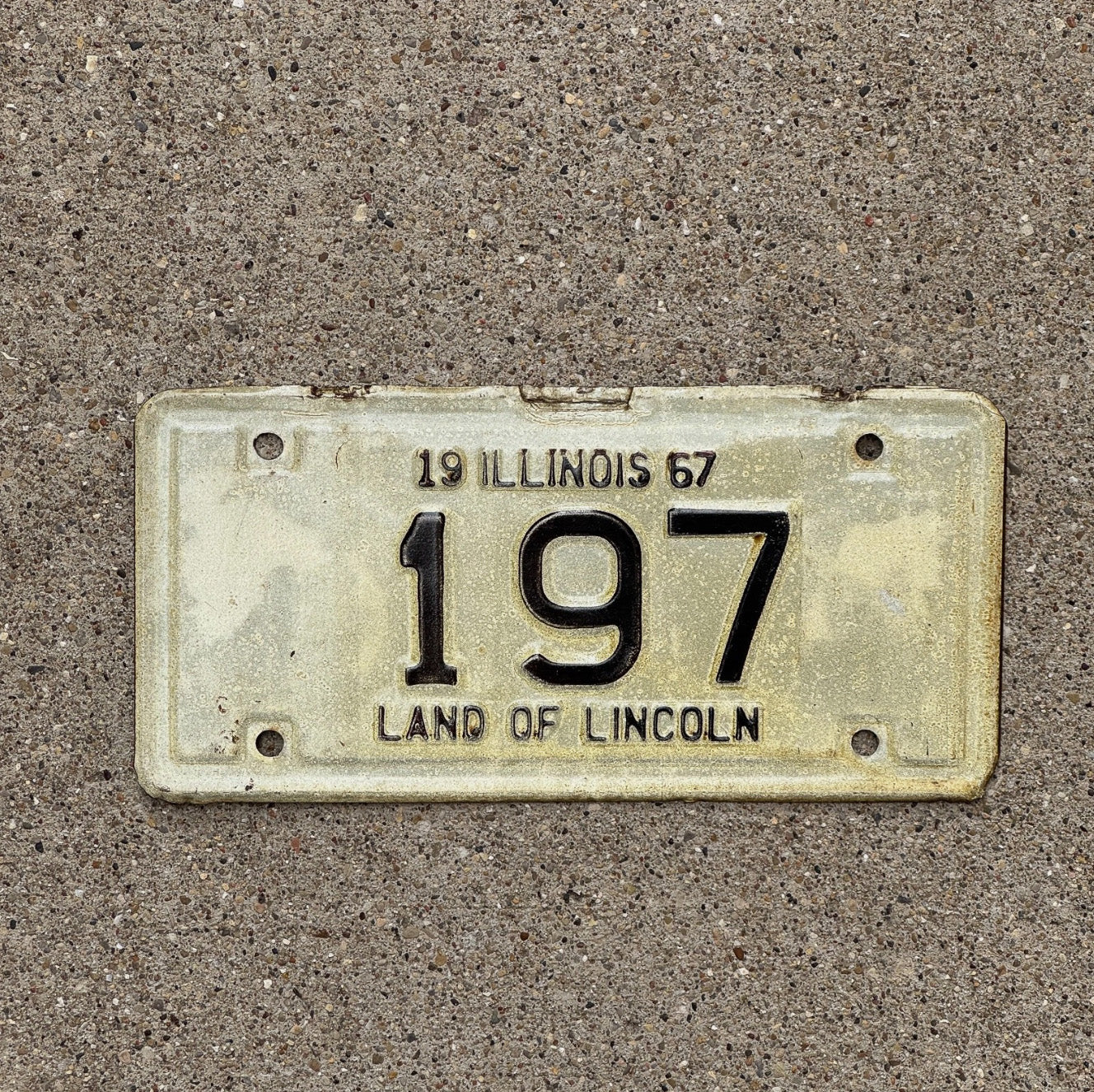 Photo of a 1967 Illinois Motorcycle License Plate Auto Tag Garage Decor Vintage Low Number Three Digit 197 with original patina