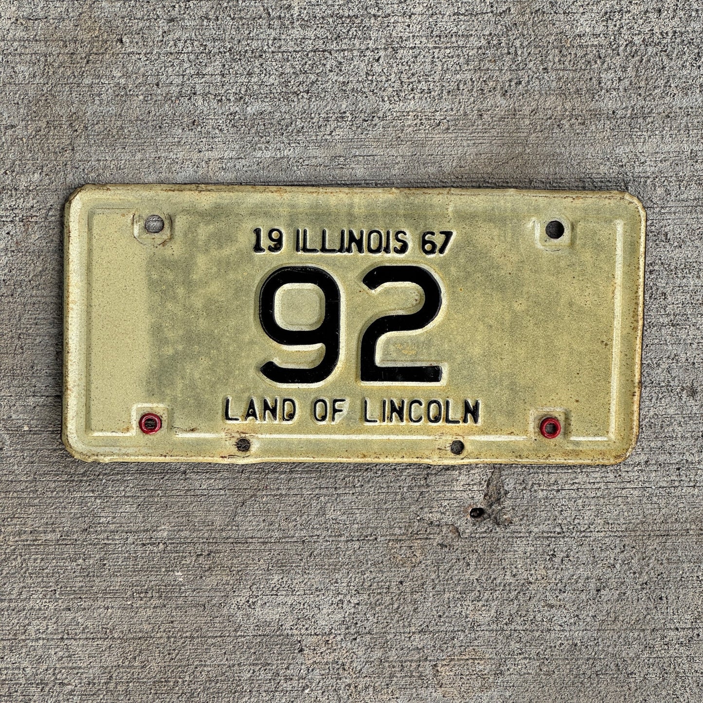 Photo of a 1967 Illinois Motorcycle License Plate Auto Tag Garage Decor Vintage Low Number Two Digit 92 with original patina