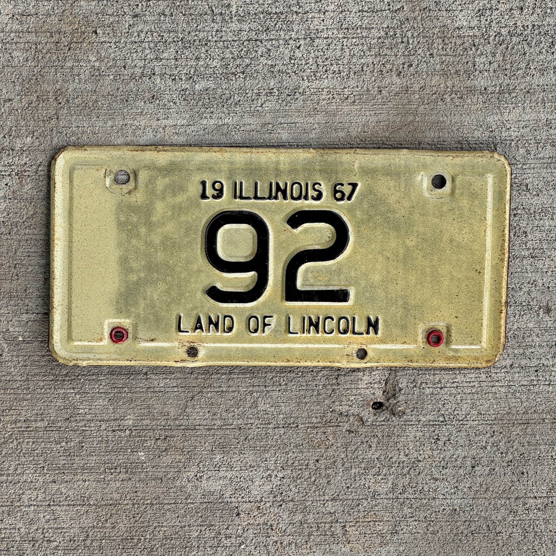 Photo of a 1967 Illinois Motorcycle License Plate Auto Tag Garage Decor Vintage Low Number Two Digit 92 with original patina