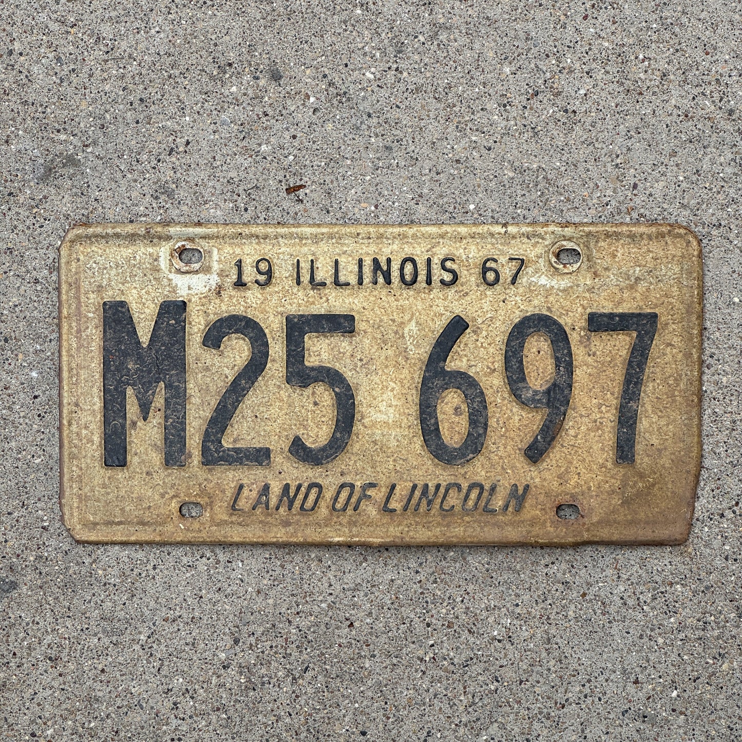 Photo of a 1967 Illinois Municipal License Plate Auto Tag 1 Vintage Garage M 25 697 with original patina