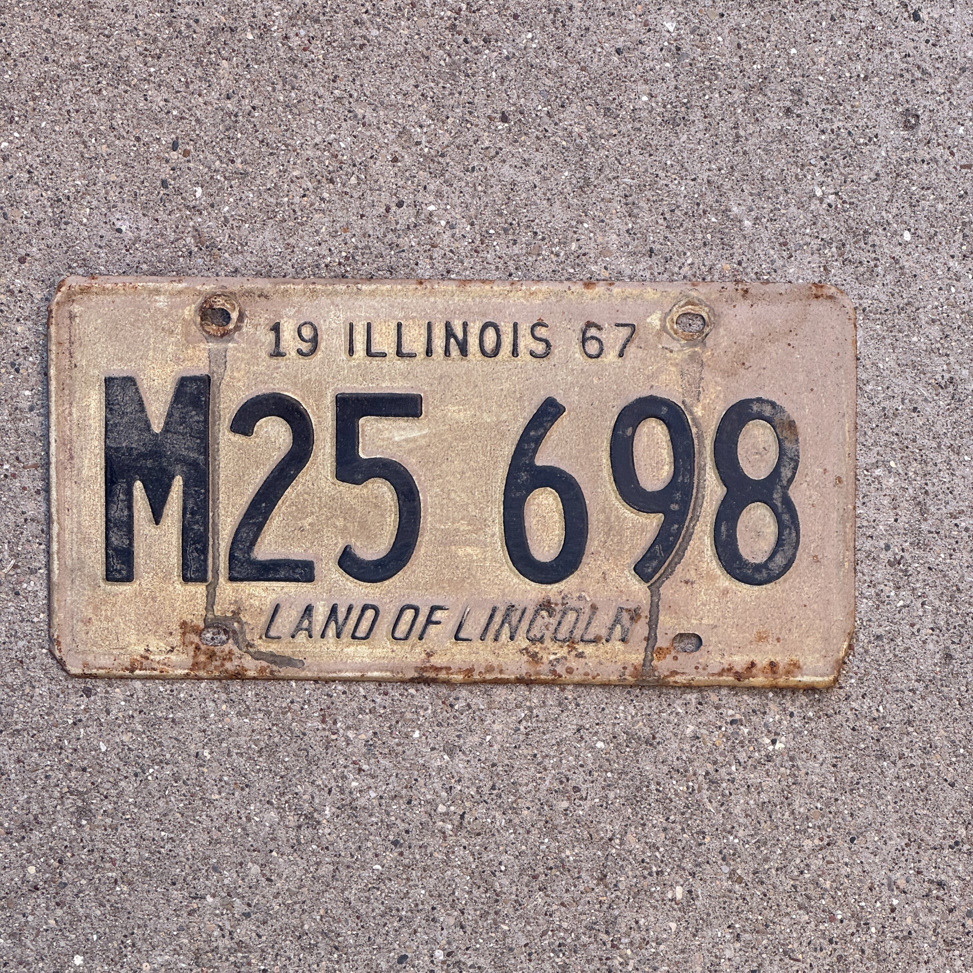 Photo of a 1967 Illinois Municipal License Plate Auto Tag 1 Vintage Garage M 25 698 with original patina