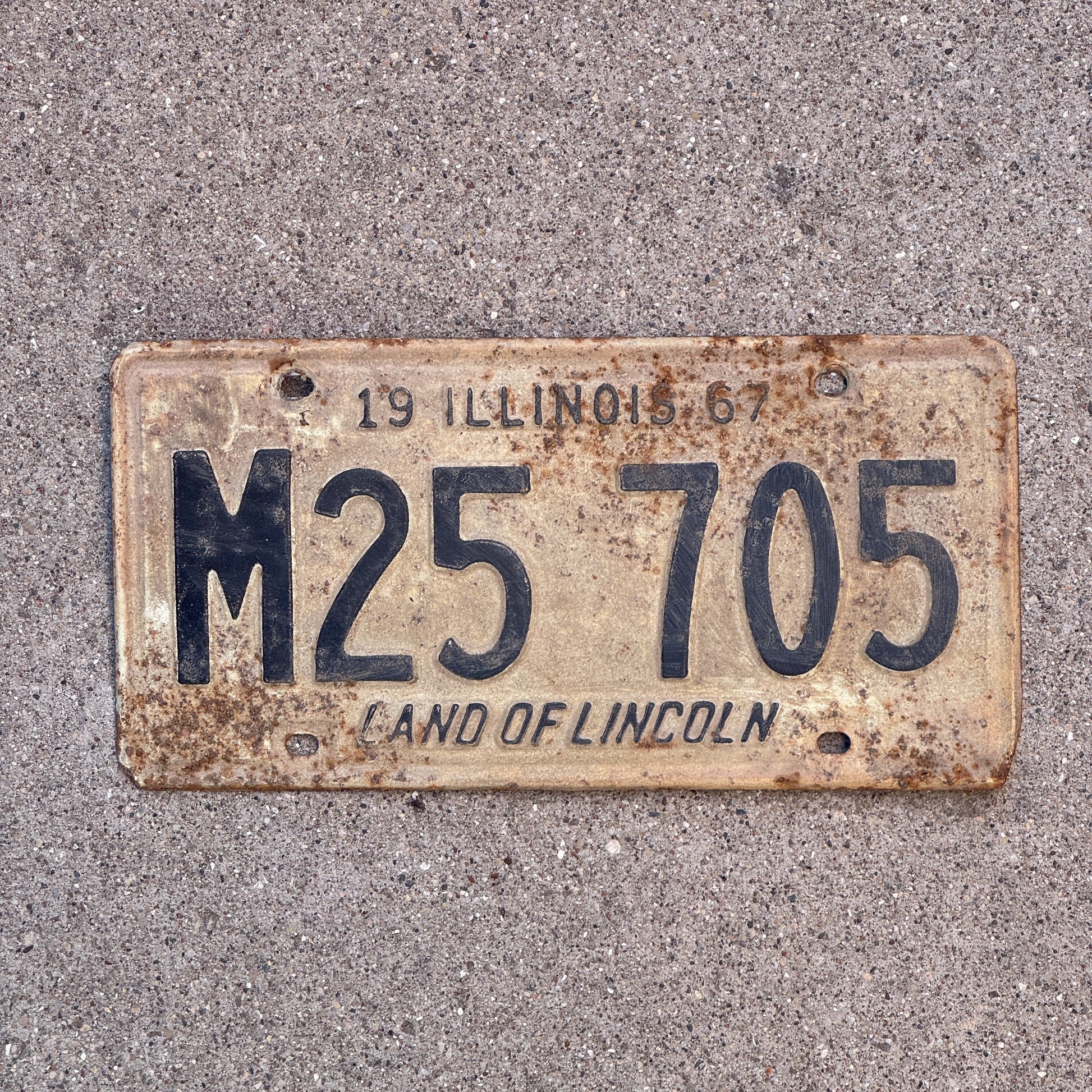 Photo of a 1967 Illinois Municipal License Plate Auto Tag 1 Vintage Garage M 25 705 with original patina