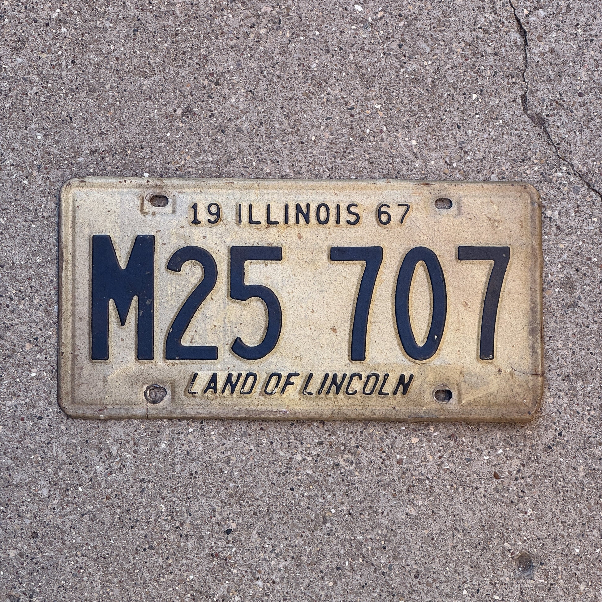 Photo of a 1967 Illinois Municipal License Plate Auto Tag 1 Vintage Garage M 25 707 with original patina