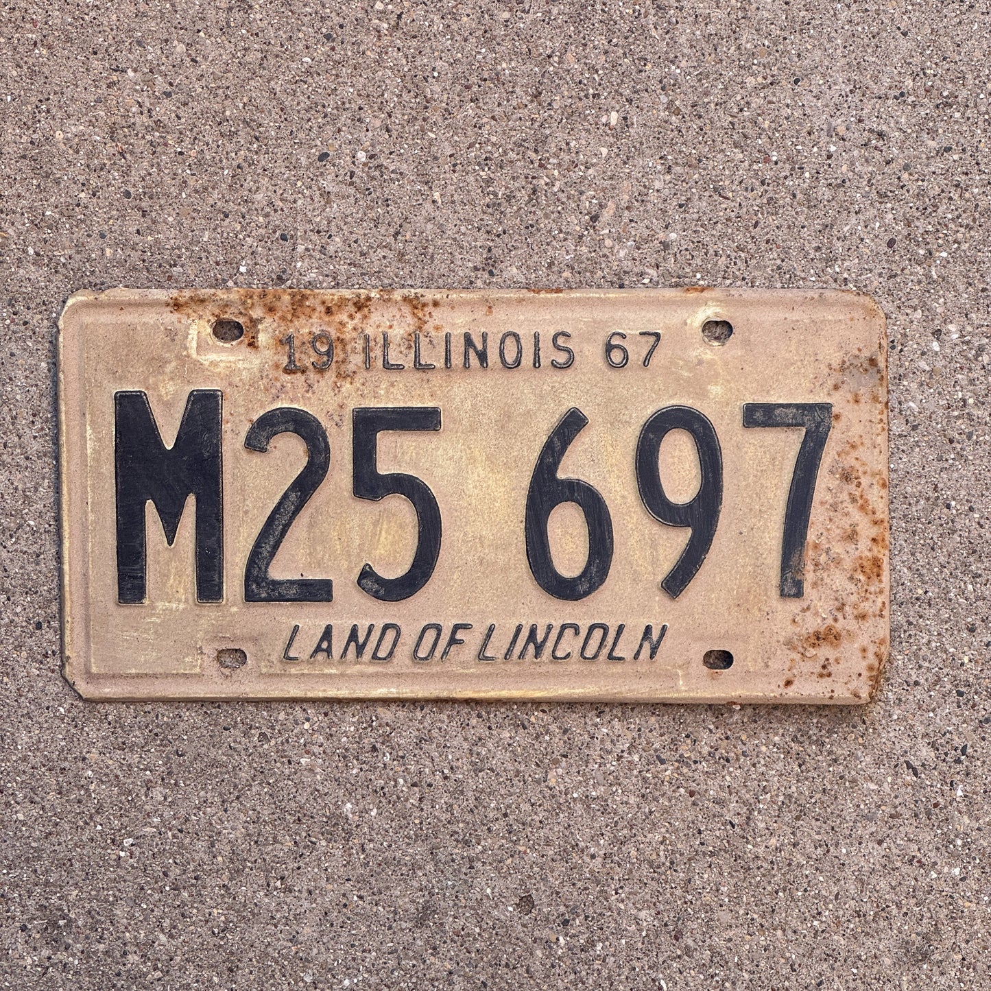Photo of a 1967 Illinois Municipal License Plate Auto Tag 2 Vintage Garage M 25 697 with original patina