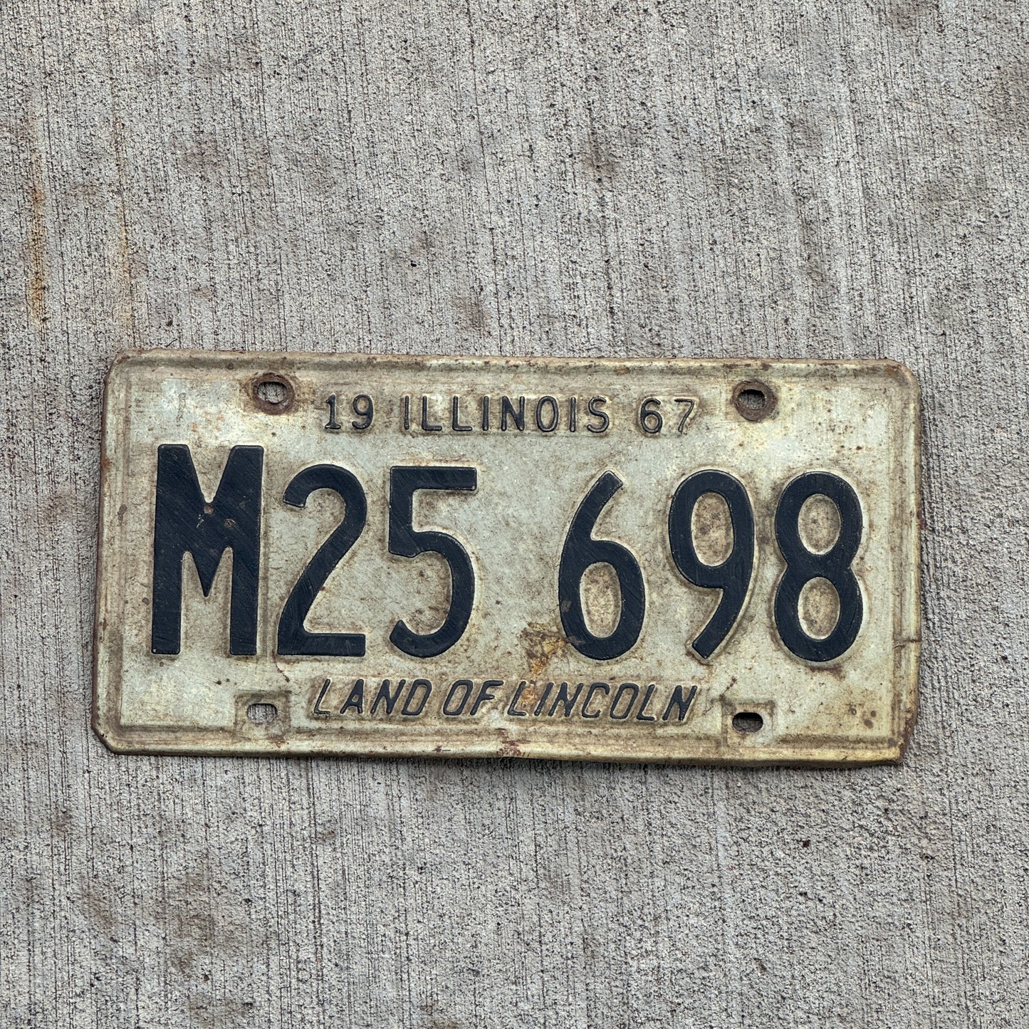 Photo of a 1967 Illinois Municipal License Plate Auto Tag 2 Vintage Garage M 25 698 with original patina