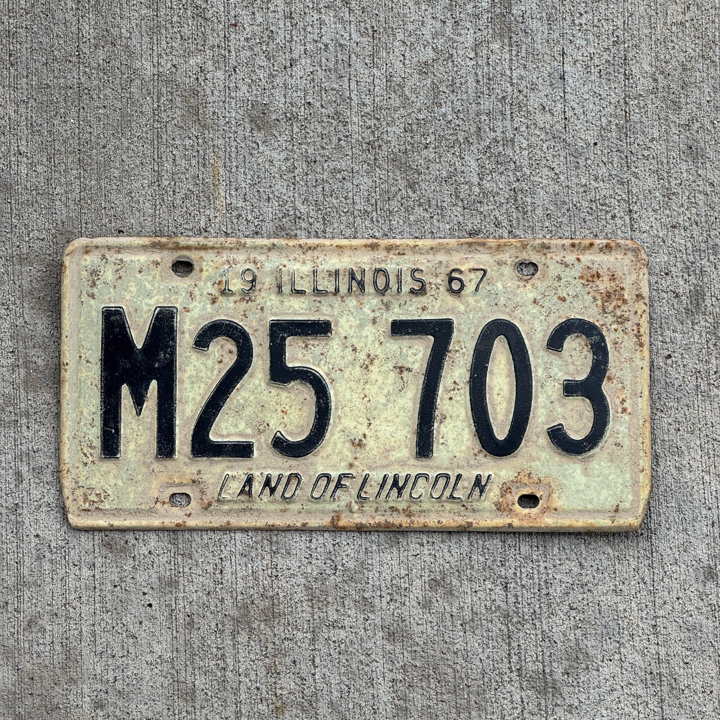 Photo of a 1967 Illinois Municipal License Plate Auto Tag 2 Vintage Garage M 25 703 with original patina