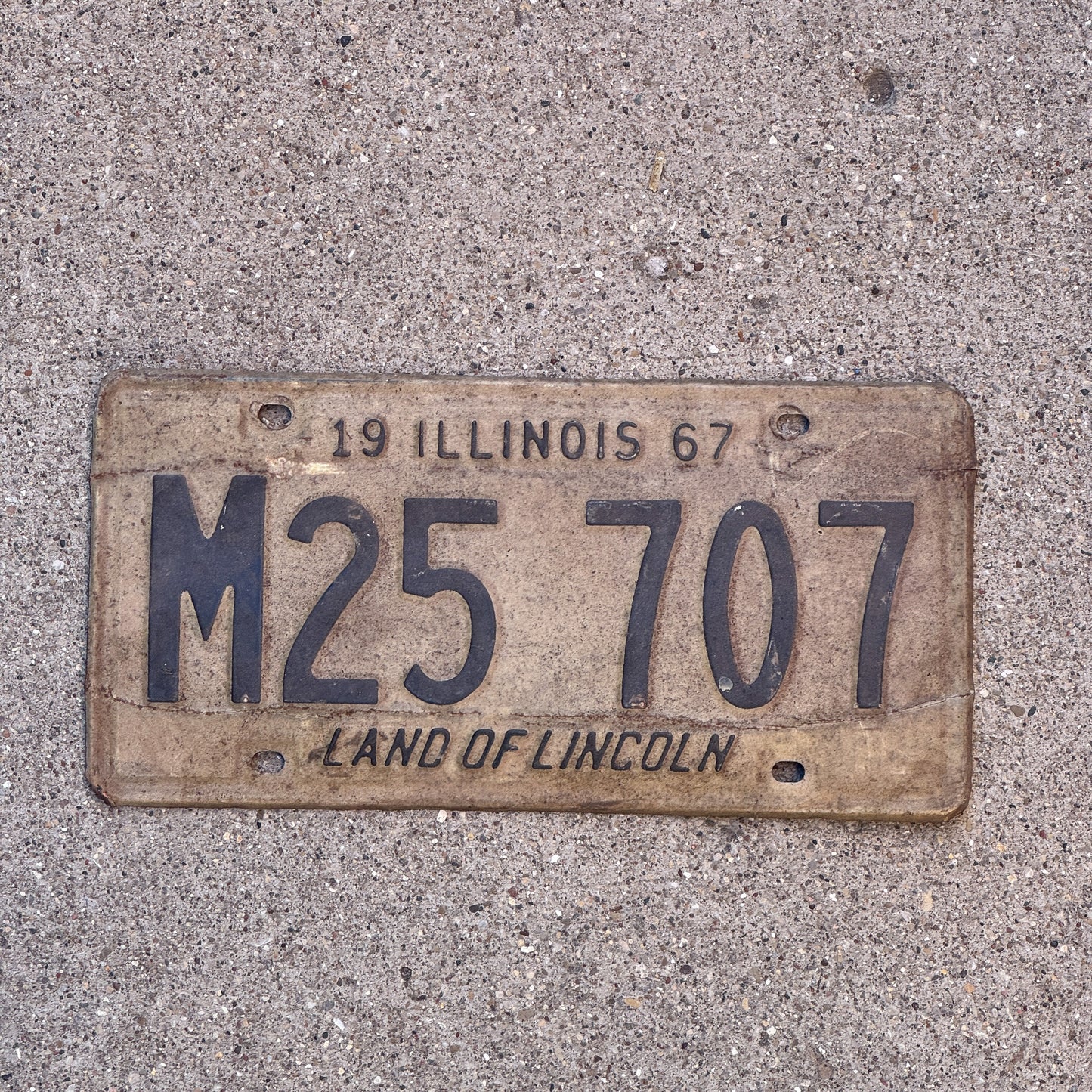 Photo of a 1967 Illinois Municipal License Plate Auto Tag 2 Vintage Garage M 25 707 with original patina