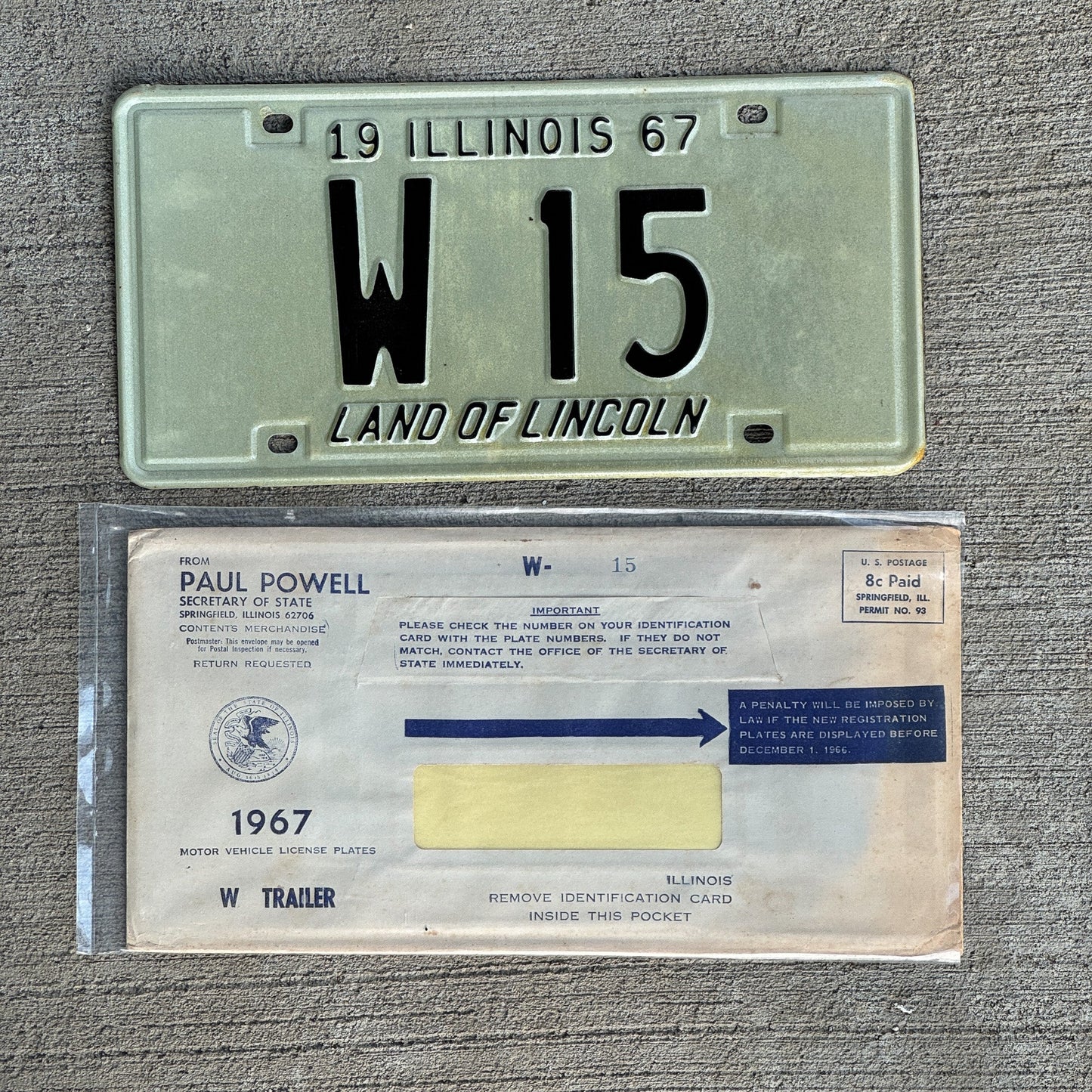 Photo of a 1967 Illinois Trailer License Plate Auto Tag Garage Decor Vintage Low Number Two Digit with Envelope W 15 with original patina