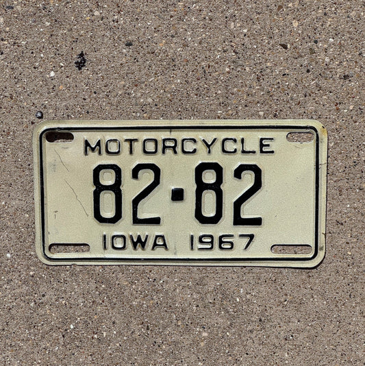 Photo of a 1967 Iowa Motorcycle License Plate Auto Tag Garage Decor Low Number Two Digit Repeat Repeating Scott County 82 82 with original patina
