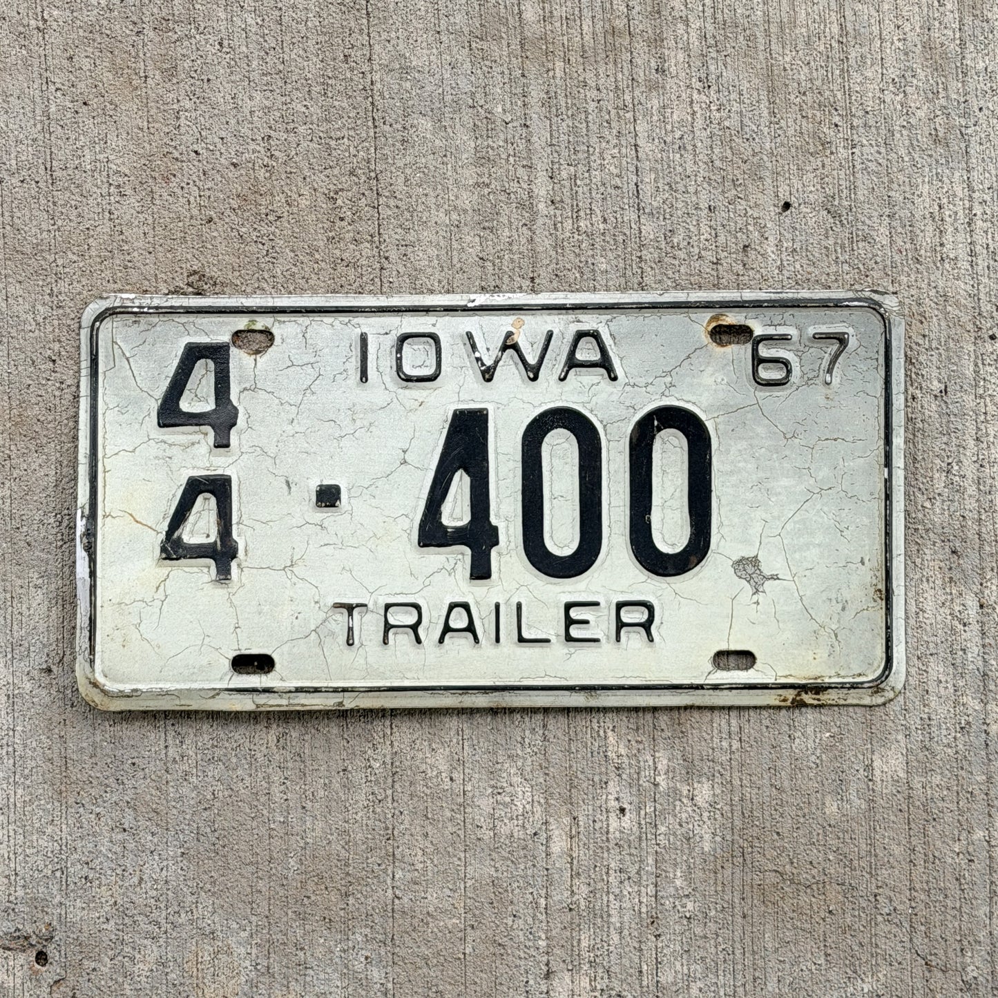 Photo of a 1967 Iowa Trailer License Plate Auto Tag Garage Decor Vintage Repeat Repeating 44 400 with original patina