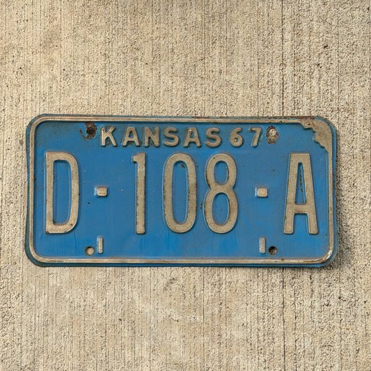 Photo of a 1967 Kansas Dealer License Plate Auto Tag Garage Decor Vintage D 108 A with original patina