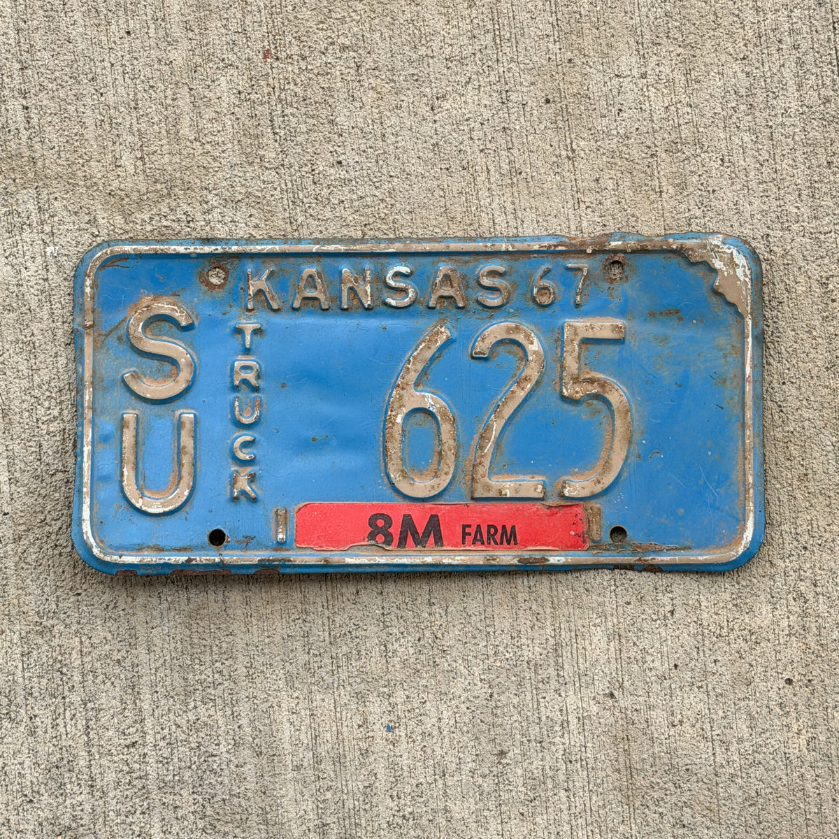 Photo of a 1967 Kansas Farm Truck License Plate Auto Tag Garage Decor Vintage SU 625 with original patina