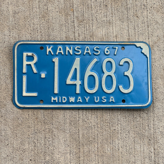 Photo of a 1967 Kansas License Plate Auto Tag Garage Decor Vintage RL 14683 with original patina