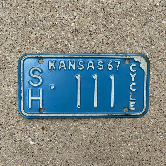 Photo of a 1967 Kansas Motorcycle License Plate Auto Tag Garage Decor Vintage Repeat Repeating Sherman County SH 111 with original patina
