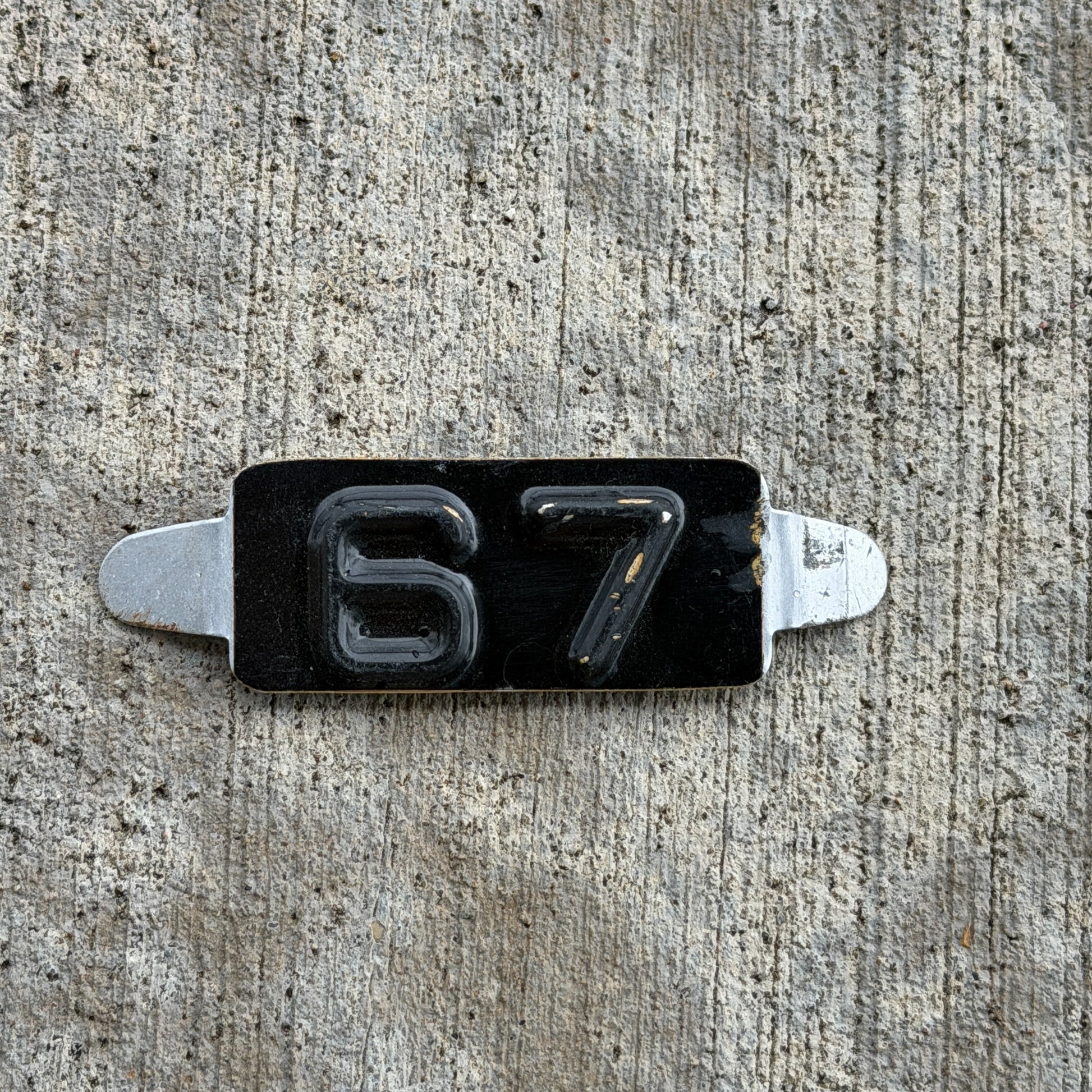 Photo of a 1967 Maine Tab License Plate Auto Tag Garage Decor Vintage with original patina