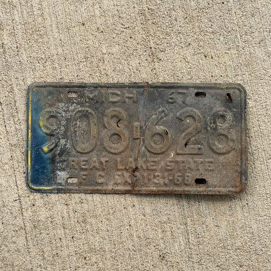Photo of a 1967 Michigan Farm License Plate Auto Tag Garage Decor Vintage 908 628 with original patina