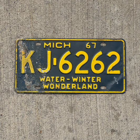 Photo of a 1967 Michigan License Plate Auto Tag Garage Decor Vintage Repeat Repeating KJ 6262 with original patina