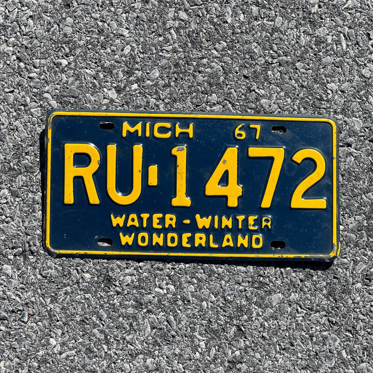 Photo of a 1967 Michigan License Plate Auto Tag Garage Decor Vintage RU 1472