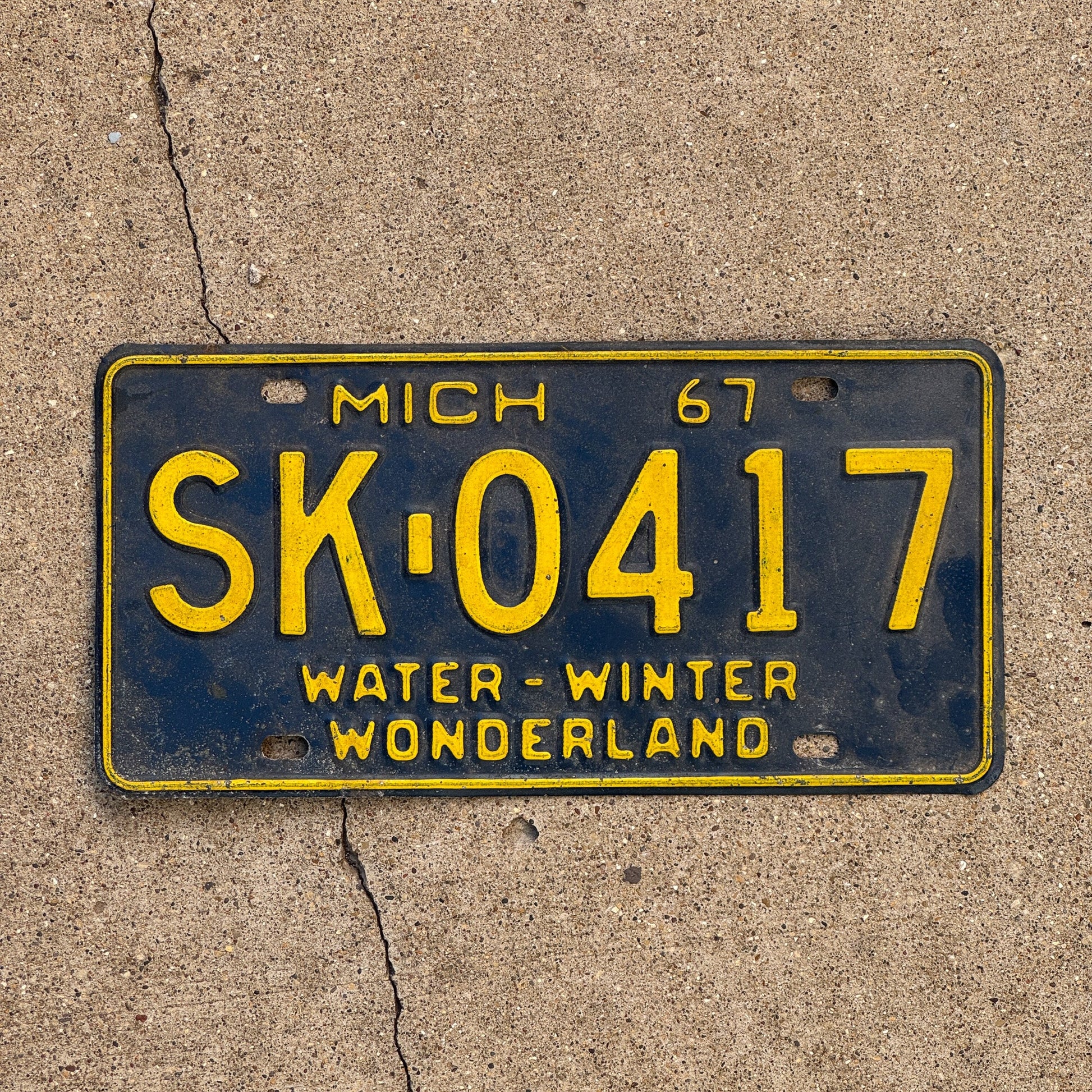 Photo of a 1967 Michigan License Plate Auto Tag Garage Decor Vintage SK 0417
