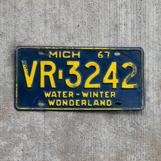 Photo of a 1967 Michigan License Plate Auto Tag Garage Decor Vintage VR 3242 with original patina