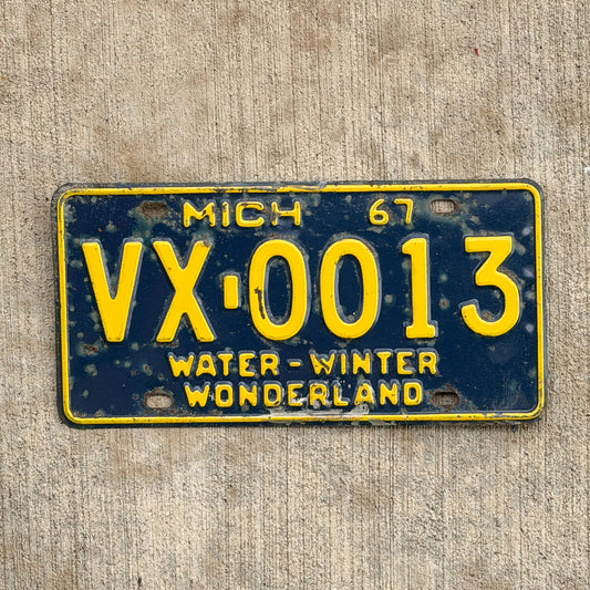 Photo of a 1967 Michigan License Plate Auto Tag Garage Decor Vintage VX 0013 with original patina