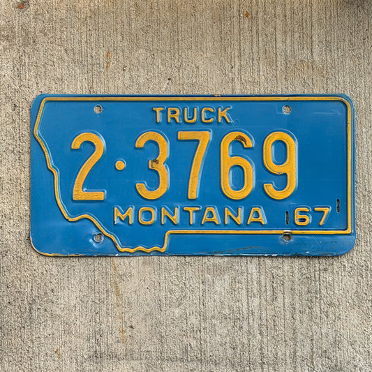Photo of a 1967 Montana Truck License Plate Auto Tag Garage Decor Vintage State Shape 2 3769 with original patina