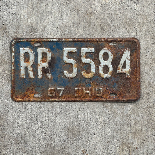 Photo of a 1967 Ohio License Plate Auto Tag Garage Decor Vintage RR 5584 with original patina