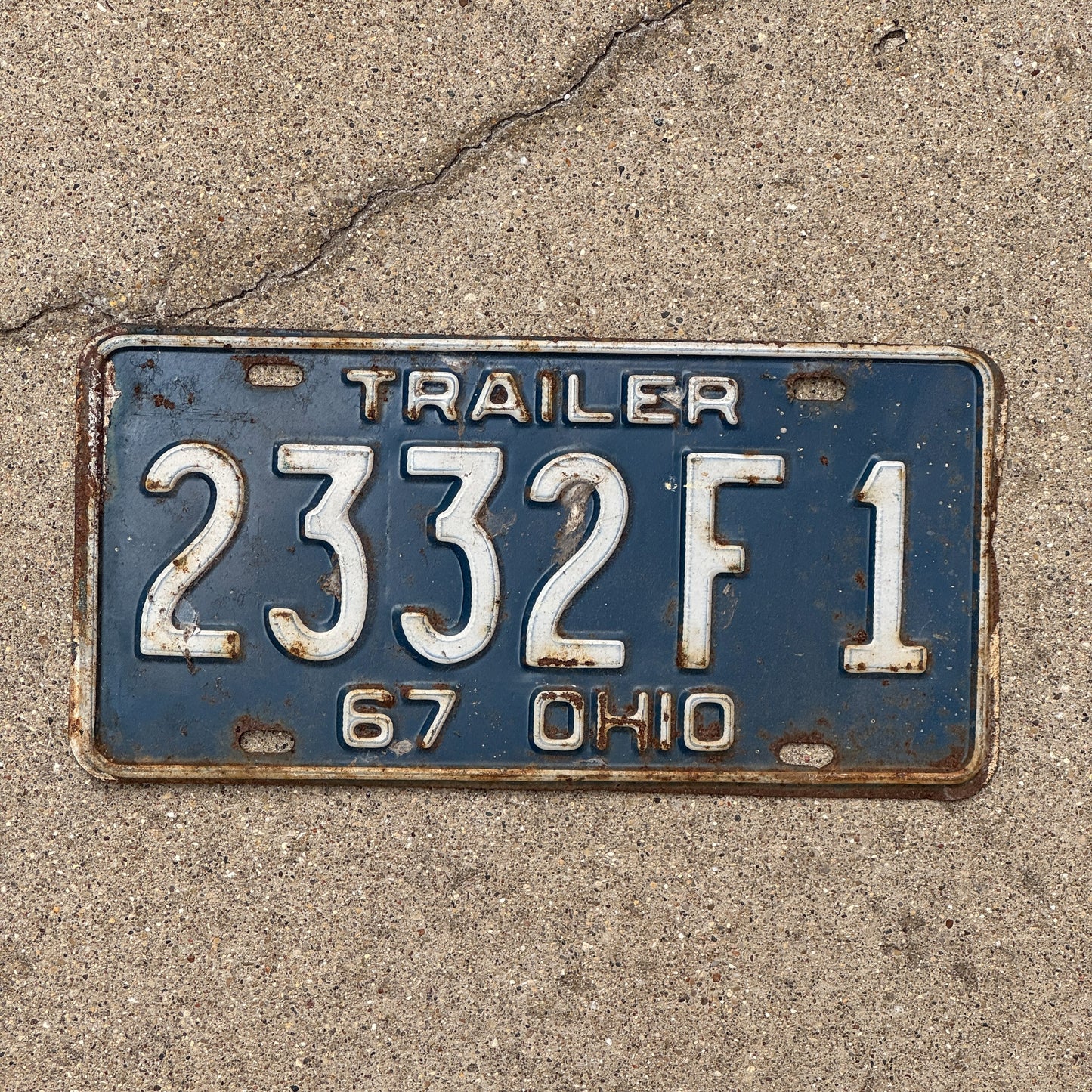 Photo of a 1967 Ohio Trailer License Plate Auto Tag Garage Decor Vintage 2332 F 1 with original patina