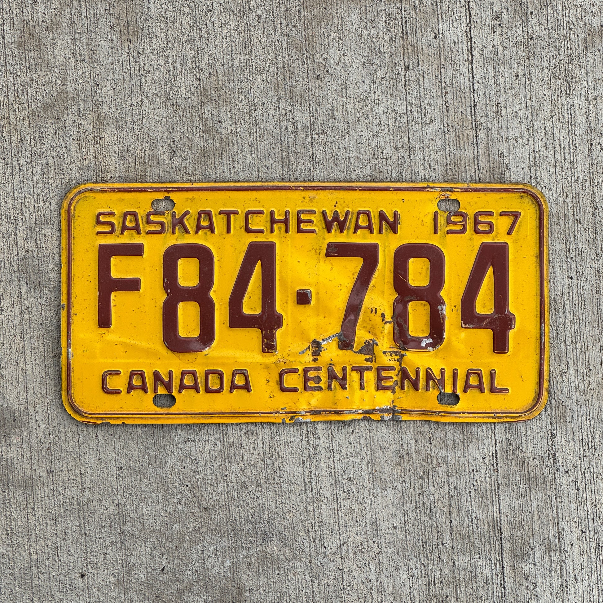 Photo of a 1967 Saskatchewan Farm Truck License Plate Auto Tag Garage Decor Vintage F 84 784 with original patina