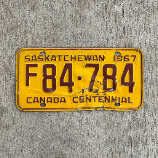 Photo of a 1967 Saskatchewan Farm Truck License Plate Auto Tag Garage Decor Vintage F 84 784 with original patina