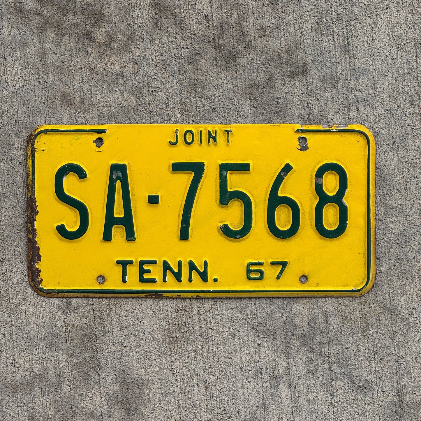 Photo of a 1967 Tennessee Joint Truck License Plate Auto Tag Garage Decor Vintage SA 7568 with original patina
