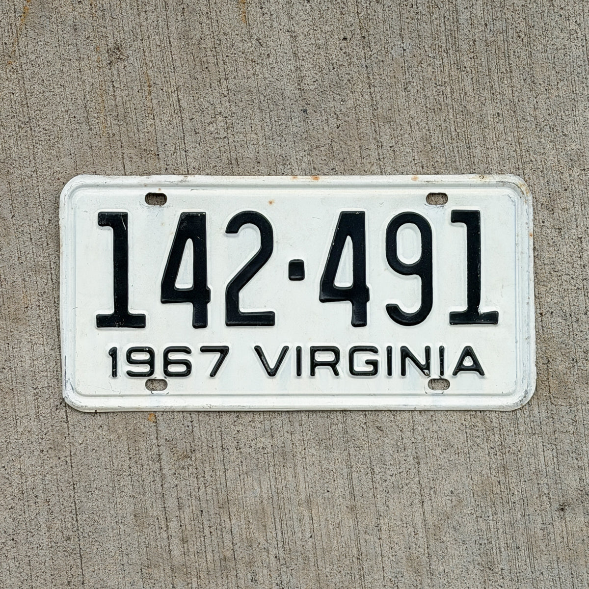 Photo of a 1967 Virginia License Plate Auto Tag Garage Decor Vintage 142 491 with original patina
