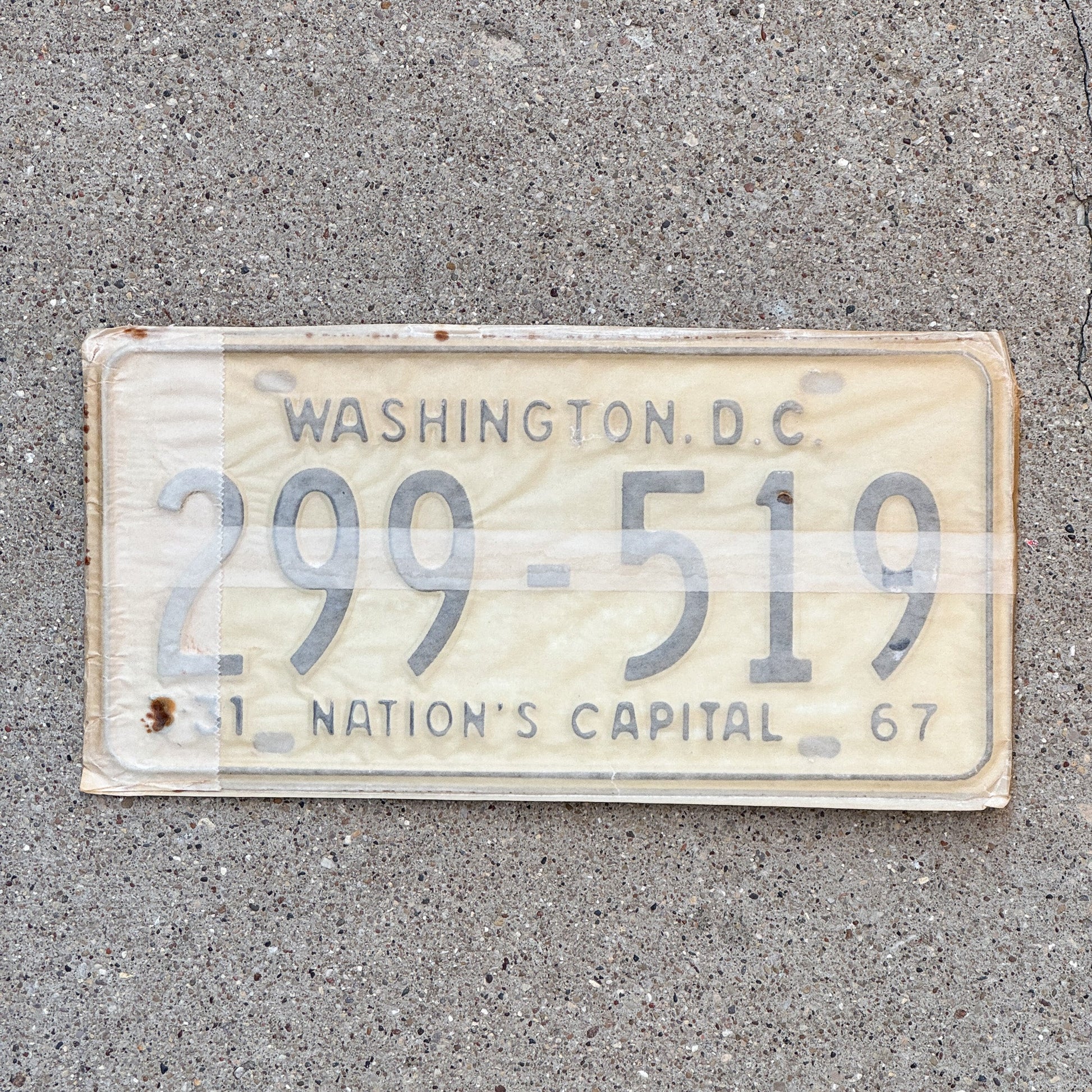 Photo of a 1967 Washington DC License Plate Pair Auto Tag Garage Decor Vintage with Envelope 299 519 with original patina